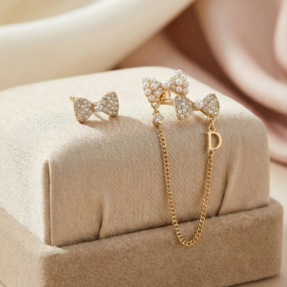Asymmetrical Pearl Bow Drop Earrings
